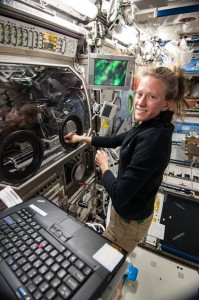 One of our “people in space,” NASA astronaut Karen Nyberg works with the InSPACE-3 colloid investigation in the Microgravity Science Glovebox. (NASA)