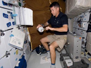 Astronaut Shane Kimbrough works with a Group Activation Pack (GAP) aboard the space shuttle Endeavour during an assembly mission to the International Space Station. (NASA)