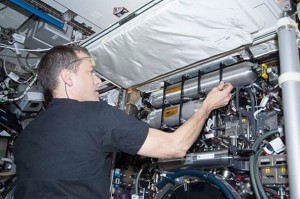 NASA astronaut Tom Marshburn servicing the Combustion Integrated Rack (CIR) aboard the Destiny module of the International Space Station. (NASA)