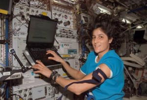 Astronaut Sunita Williams, Expedition 14 flight engineer, prepares a laptop for data entry during a blood draw as part of the Nutritional Status Assessment (Nutrition) study in the Destiny laboratory module of the International Space Station. (NASA)