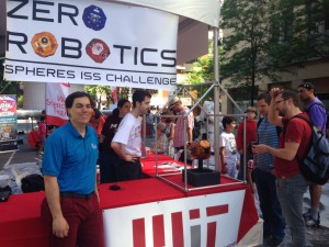 At left, Alvar Saenz-Otero, Ph.D., and his team present the Zero Robotics: International Space Station Programing Challenge to the public at the World Science Festival in New York. (Tara Ruttley)