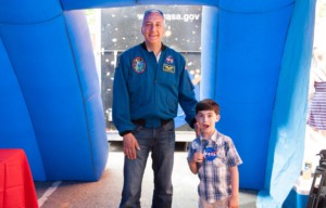 NASA astronaut Mike Massimino meets a young fan at the 2014 World Science Festival. (World Science Festival)