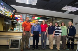 Image from the Payload Operations Integration Center's 12th anniversary, from left, Kevin Barnes, payload rack officer; Rick Rodriguez, Stephanie Buskirk Dudley and Katie Presson, all payload operations directors; Penny Pettigrew, payload communications manager; Carol Jacobs, payload operations director; and Ola Myszka, operations controller. (NASA/Emmett Given)