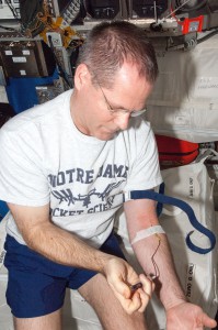 NASA astronaut Kevin Ford is drawing his blood on the International Space Station. Blood samples allow scientists to assess nutrition status. (NASA)