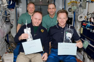 In 2008, astronauts aboard the International Space Station demonstrated the pouch method of drinking yesterday’s coffee and today’s coffee, while the Space Cup will serve the coffee of tomorrow — providing real science for fluid physics research. In the front, left to right, crew members Michael Finke and Chris Ferguson, with Eric Boe and Donald Pettit in the back. (NASA)