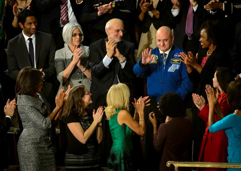 NASA astronaut Scott Kelly stands as he is recognized by President Barack Obama, while First Lady Michelle Obama (lower left corner) and other guests applaud. The President recognized Kelly during the State of the Union address on Capitol Hill in Washington D.C. on Jan. 20, 2015. (NASA/Bill Ingalls)