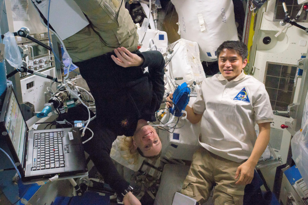 NASA astronaut Kate Rubins (L) and JAXA astronaut Takuya Onishi participated in the ESA Airway Monitoring investigation last week. Credits: NASA 