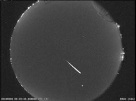 Perseid meteor streaks over sky