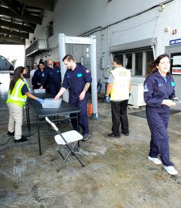 Marshall's flight team completes a TSA check before boarding G Force One.