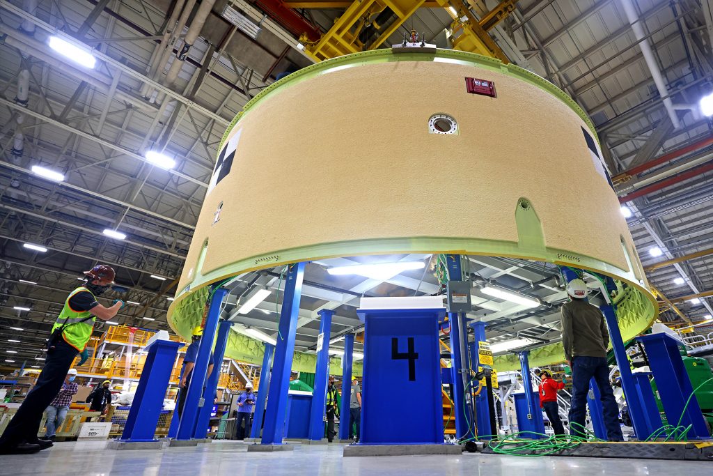 This image shows the forward skirt that will be used on the core stage of NASA’s Space Launch System rocket for Artemis II, the first crewed mission of NASA’s Artemis program, at NASA’s Michoud Assembly Facility. The SLS core stage is made up of five unique elements: the forward skirt, liquid oxygen tank, intertank, liquid hydrogen tank, and the engine section. The forward skirt houses flight computers, cameras, and avionics systems. The hardware is located at the top of the 212-foot-tall core stage and connects the upper part of the rocket to the core stage. Soon, technicians will ready the forward skirt for the first of three core stage assembly mates called the forward join. The forward join consists of three main parts -- the forward skirt, liquid oxygen tank, and intertank – to create the top, or forward part, of the core stage. Together with its four RS-25 engines, the rocket’s massive 212-foot-tall core stage — the largest stage NASA has ever built — and its twin solid rocket boosters will produce 8.8 million pounds of thrust to send NASA’s Orion spacecraft, astronauts and supplies beyond Earth’s orbit to the Moon and, ultimately, Mars. Offering more payload mass, volume capability and energy to speed missions through space, the SLS rocket, along with NASA’s Gateway in lunar orbit, the human landing system, and Orion spacecraft, is part of NASA’s backbone for deep space exploration and the Artemis lunar program. No other rocket is capable of carrying astronauts in Orion around the Moon in a single mission. Image credit: NASA/Michael DeMocker