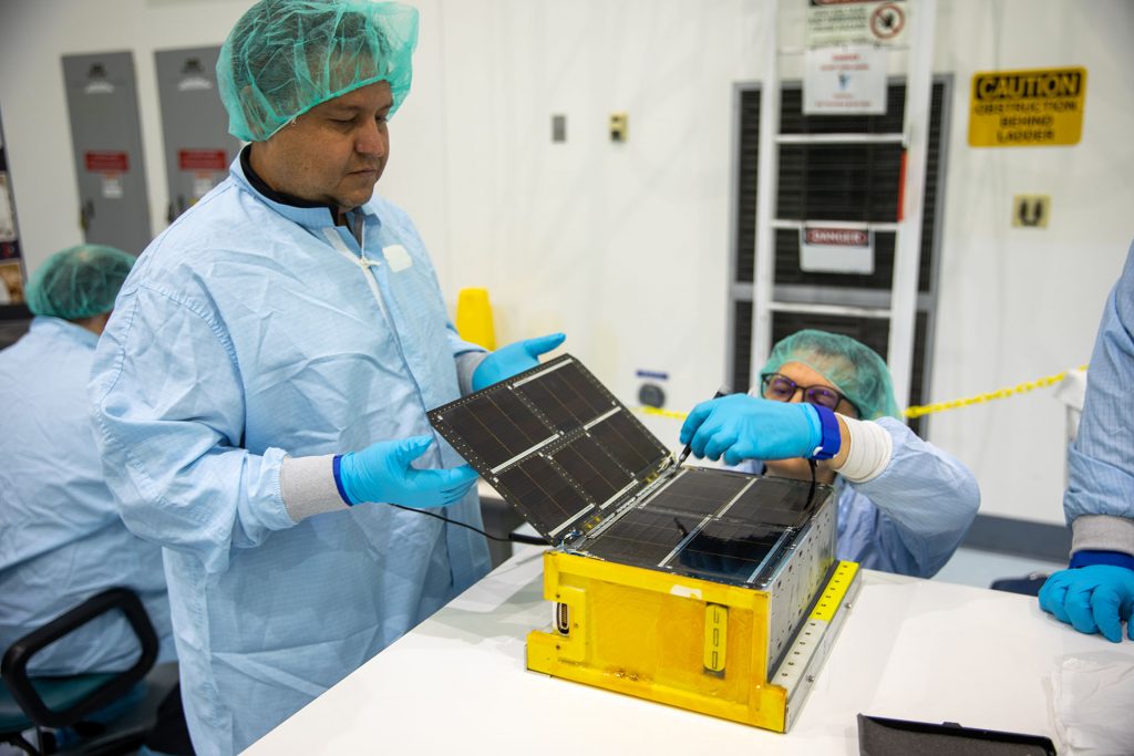 Team Miles works in a clean room at NASA’s Kennedy Space Center