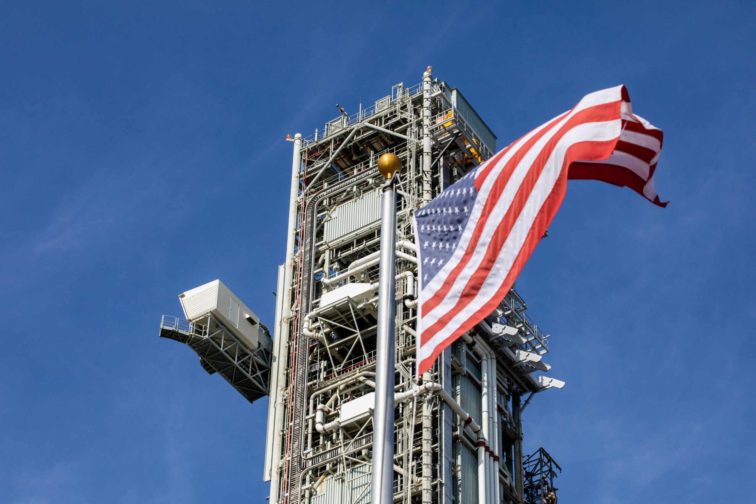 The top part of mobile launcher 1, carried by the crawler-transporter 2, rolls out from its park site location to Launch Pad 39B at NASA’s Kennedy Space Center in Florida on Aug. 16, 2023.