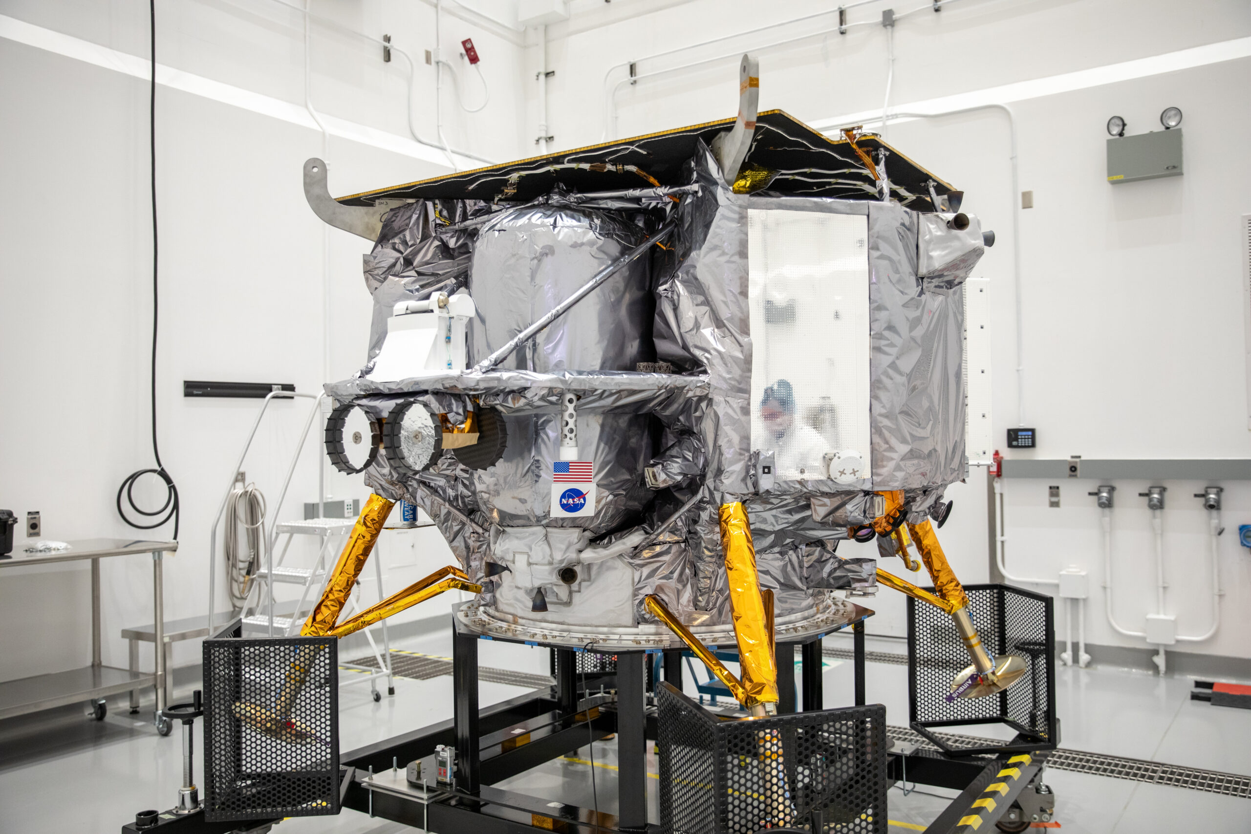 Teams with Astrobotic install the NASA meatball decal on Astrobotic’s Peregrine lunar lander on Tuesday, Nov. 14, 2023, at the Astrotech Space Operations Facility near the agency’s Kennedy Space Center in Florida. Peregrine will launch onboard a United Launch Alliance Vulcan rocket targeted for no earlier than Dec. 24, 2023, from Launch Complex 41 at Cape Canaveral Space Force Station in Florida.