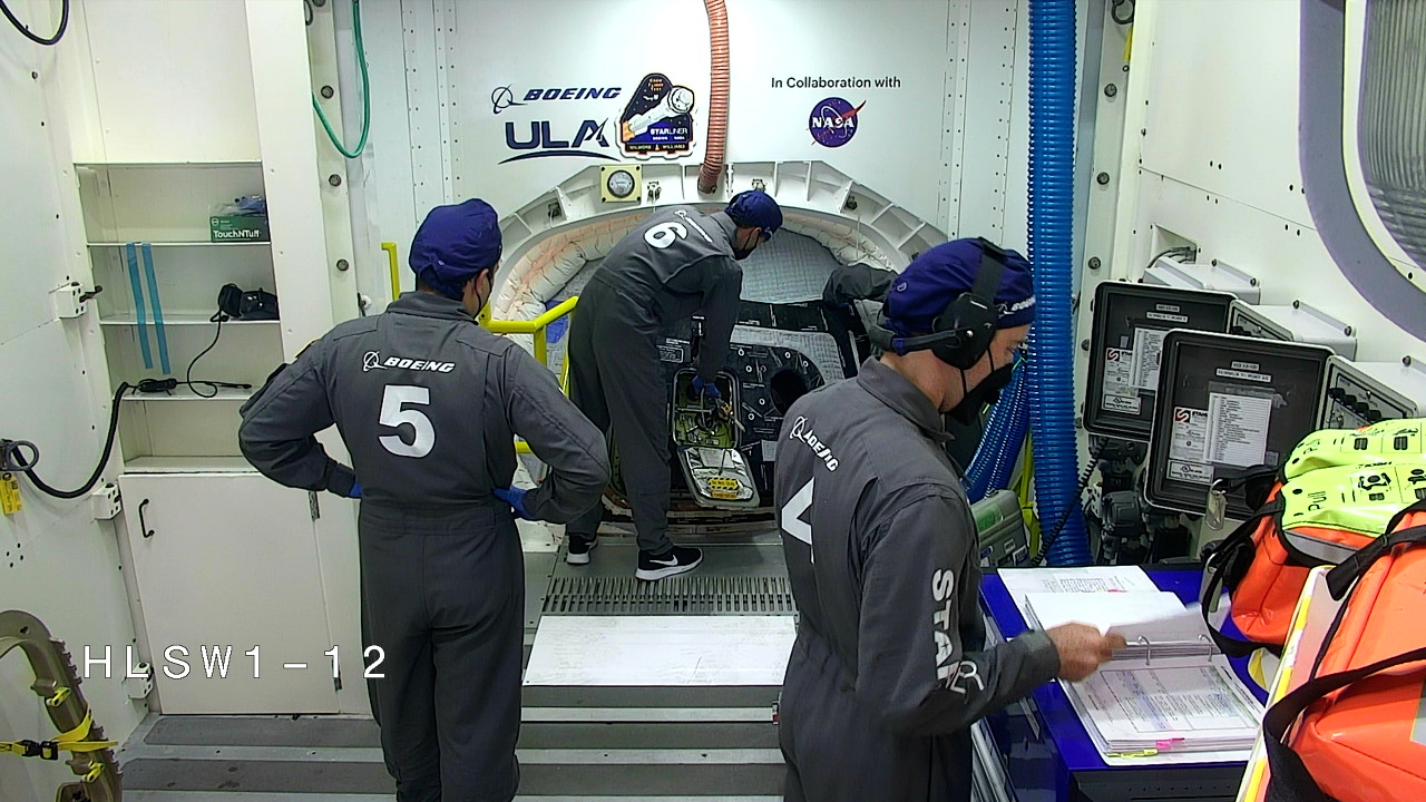 Image of Boeing crews close the hatch to the Starliner capsule carrying NASA astronauts Butch Wilmore and Suni Williams.