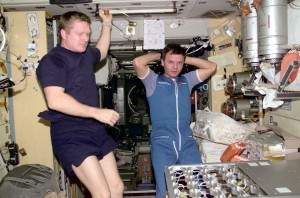 Astronaut Bill Shepherd, left, and cosmonaut Yuri Gidzenko in photo taken by cosmonaut Sergei Krikalev inside the International Space Station.