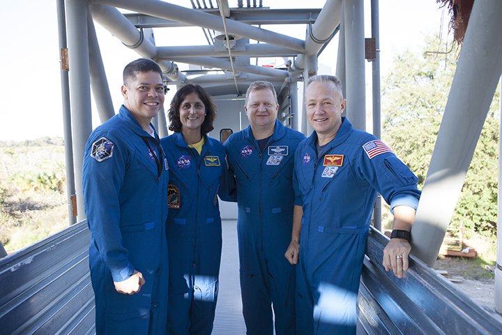 Astronauts Celebrate With Builders Topping of Crew Access Tower