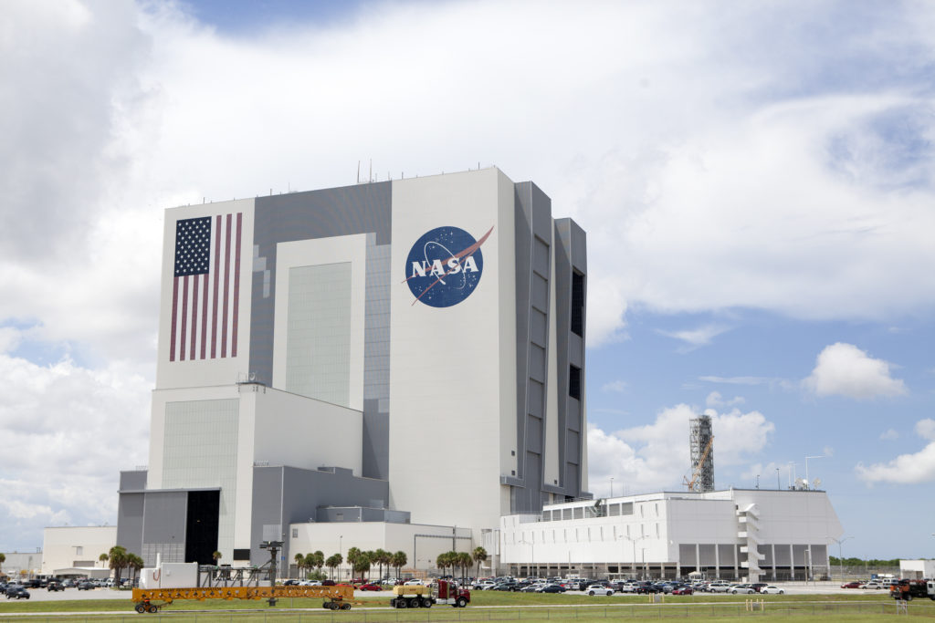 Crew Access Arm passes by the VAB at Kennedy Space Center, in route to Pad 41, to be installed for the Commerical Crew Program (CCP) upcoming missions.