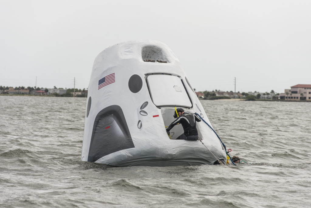 SpaceX's Recovery Trainer was lowered into the Indian River Lagoon near NASA’s Kennedy Space Center so Air Force pararescue and others could learn techniques for getting aboard the spacecraft and rescuing the astronauts.