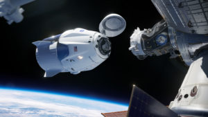 This illustration shows the SpaceX Crew Dragon spacecraft docking to the International Space Station.