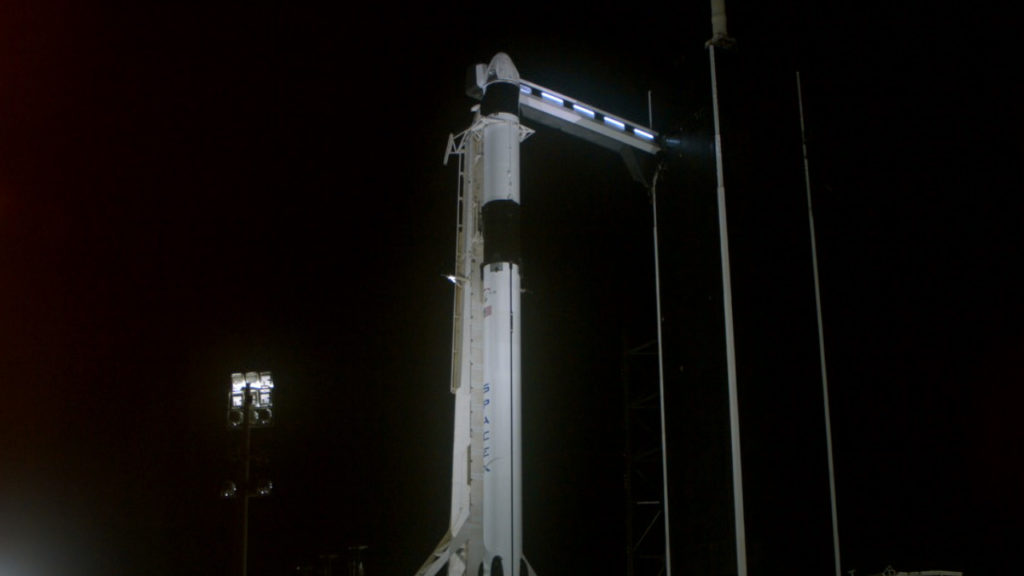 The SpaceX Falcon 9 rocket, topped by the company's Crew Dragon spacecraft, stands on the launch pad at Kennedy Space Center's Launch Complex 39A.