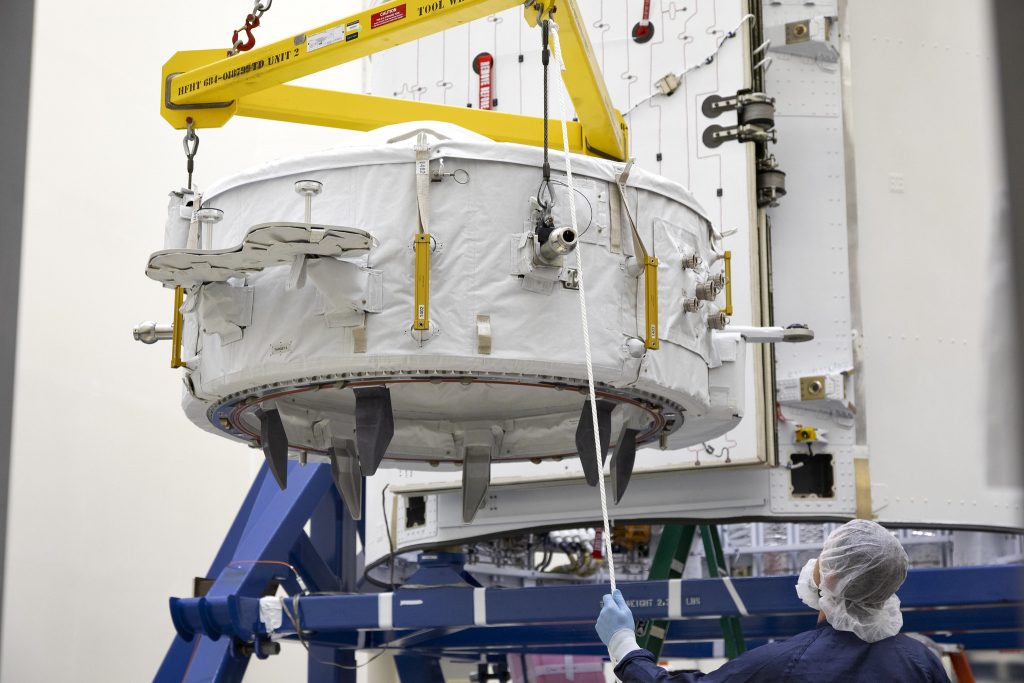 The International Docking Adapter 3, a critical component for future crewed missions to the International Space Station, is carefully packed away in the unpressurized "trunk" section of the SpaceX Dragon spacecraft at the SpaceX facility on Cape Canaveral Air Force Station in Florida on June 19.