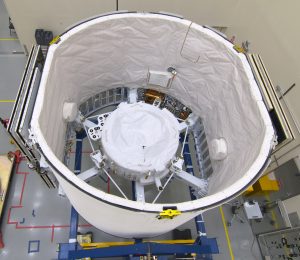 The International Docking Adapter 3, a critical component for future crewed missions to the International Space Station, is carefully packed away in the unpressurized trunk section of the SpaceX Dragon spacecraft at the SpaceX facility on Cape Canaveral Air Force Station in Florida on June 19. 