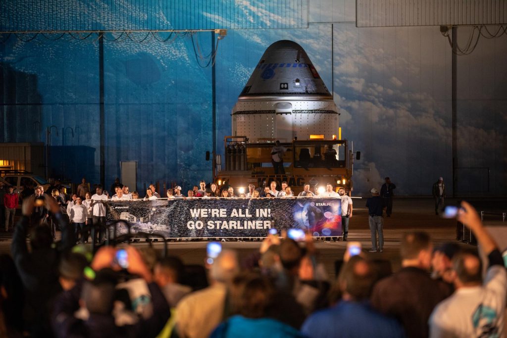 The Boeing CST-100 Starliner spacecraft rolls out from the company’s Commercial Crew and Cargo Processing Facility at NASA’s Kennedy Space Center in Florida