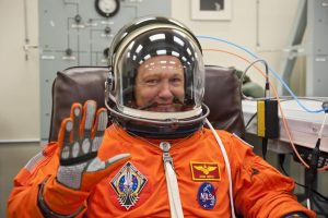 In this photo taken July 8, 2011, STS-135 pilot Douglas Hurley waves after putting on his launch-and-entry suit and helmet prior to liftoff on the final space shuttle mission.