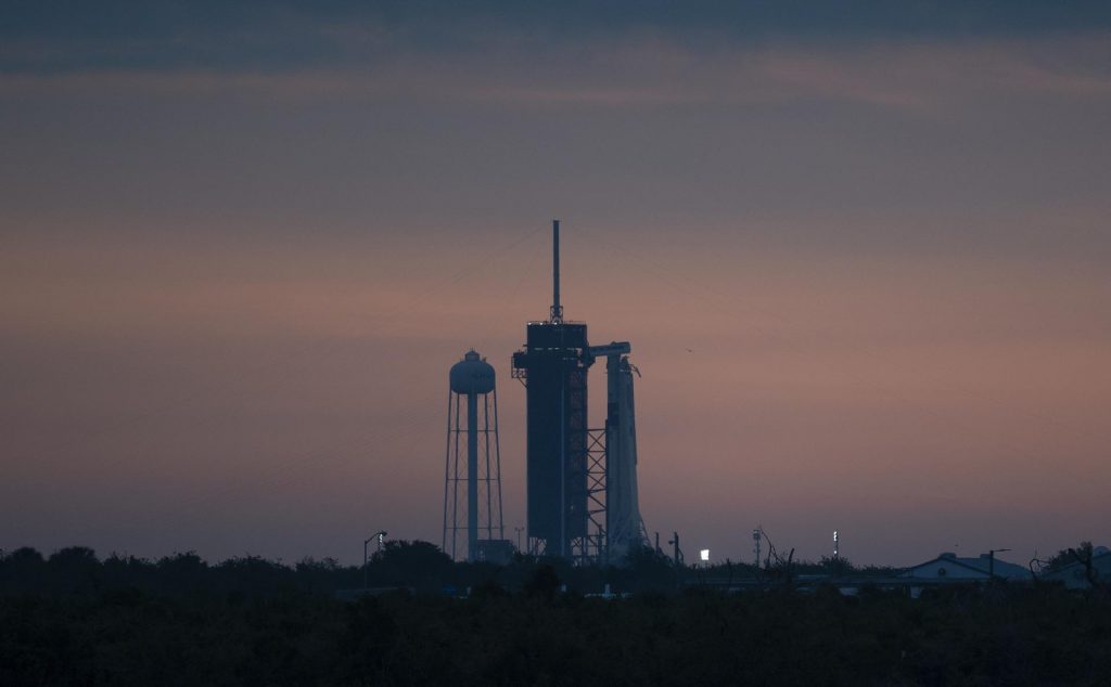 A SpaceX Falcon 9 rocket with the company's Crew Dragon spacecraft onboard is seen on the launch pad at Launch Complex 39A at sunrise as preparations continue for the Demo-2 mission, Wednesday, May 27, 2020, at NASA’s Kennedy Space Center in Florida. 