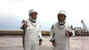 NASA astronauts Robert Behnken, left, and Douglas Hurley on Launch Complex 39A before boarding the SpaceX Crew Dragon atop the company's Falcon 9 rocket, May 27, 2020. 