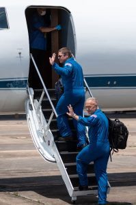 At Ellington Field near NASA’s Johnson Space Center in Houston, astronauts Robert Behnken (left) and Douglas Hurley board the Gulfstream jet that will carry them to the agency’s Kennedy Space Center in Florida on May 20, 2020, in preparation for NASA’s SpaceX Demo-2 mission. 