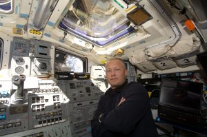 Astronaut Doug Hurley, STS-127 pilot, is pictured at space shuttle Endeavour's aft flight deck controls during flight day five operations with hardware on the International Space Station, July 19, 2009.