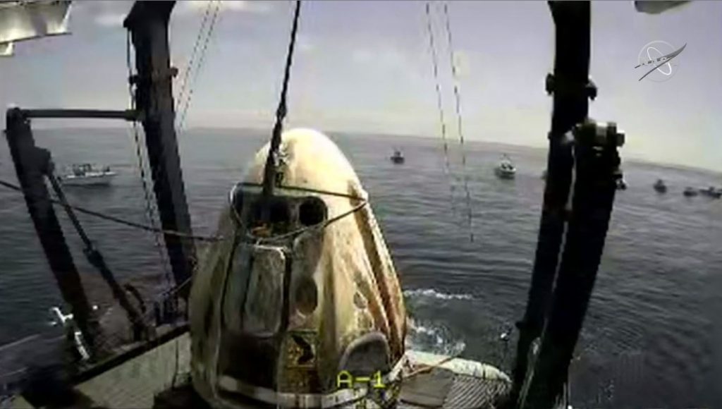 The Dragon Endeavour shortly after it was hoisted from the Gulf of Mexico on the deck of the SpaceX recovery vessel "GO Navigator."