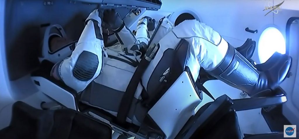 NASA astronauts Robert Behnken and Douglas Hurley inside the SpaceX Crew Dragon "Endeavor" spacecraft.