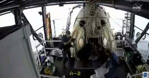 Behnken exits the Crew Dragon spacecraft. 