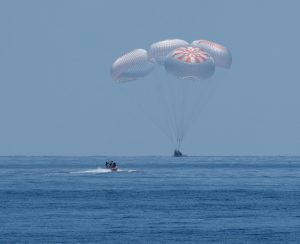 The SpaceX Crew Dragon Endeavour spacecraft is seen as it lands with NASA astronauts Robert Behnken and Douglas Hurley onboard in the Gulf of Mexico off the coast of Pensacola, Florida, Sunday, Aug. 2, 2020.