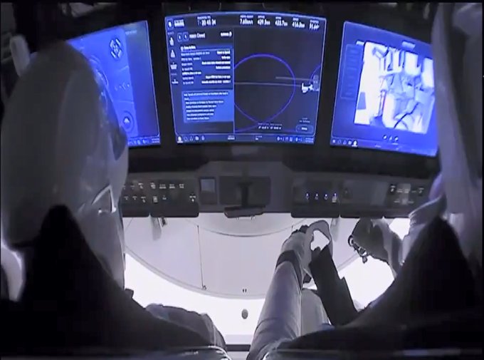 NASA astronauts Robert Behnken and Douglas Hurley inside the Crew Dragon "Endeavor" spacecraft