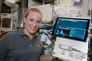 Expedition 64 Flight Engineer Kate Rubins works with Biomolecule Sequencer experiment hardware inside the U.S. laboratory Destiny aboard the International Space Station. 