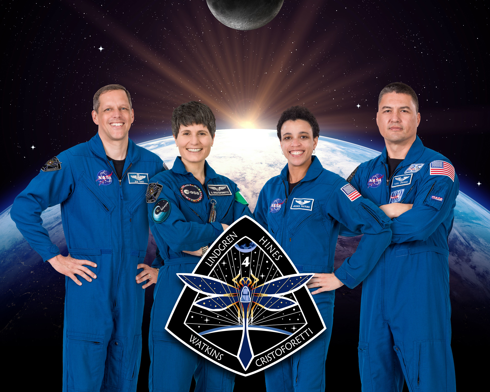 The official crew portrait of the SpaceX Crew-4 astronauts representing NASA's Commercial Crew Program. From left are, Pilot Robert Hines, Mission Specialists Samantha Cristoforetti and Jessica Watkins, and Commander Kjell Lindgren. Hines, Watkins, and Lindgren are NASA astronauts and Cristoforetti is an ESA (European Space Agency) astronaut. 