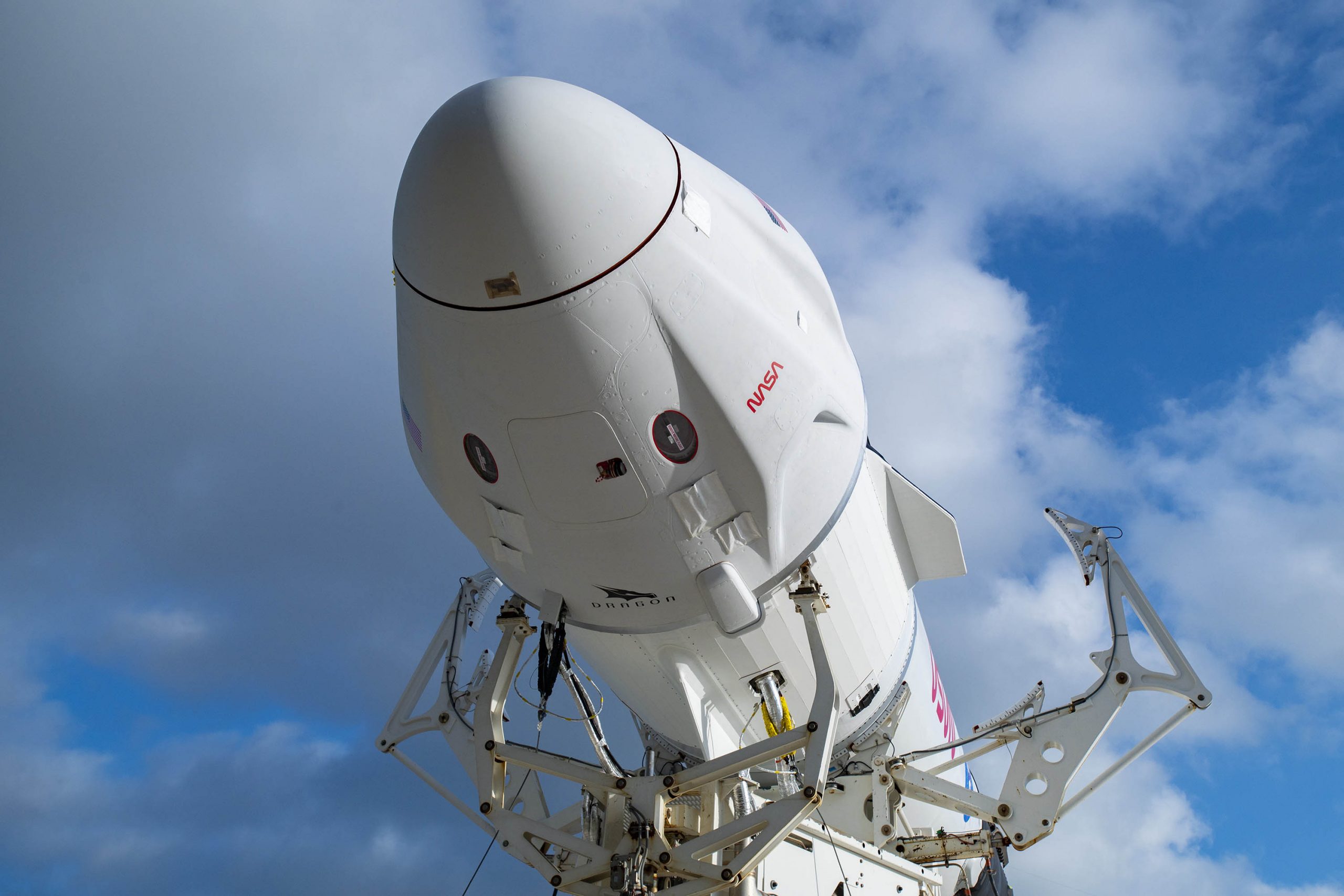 The SpaceX Falcon 9 and Dragon spacecraft that will launch NASA’s Crew-4 astronauts are mated prior rolling out of the hangar at Kennedy Space Center’s Launch Complex 39A.