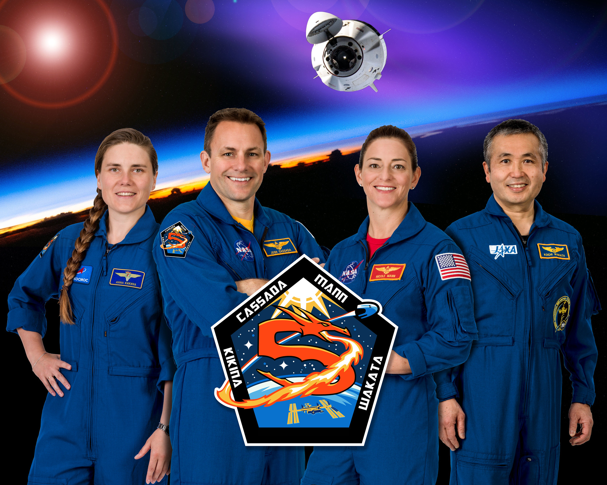 From left to right: Anna Kikina, Josh Cassada, Nicole Mann and Koichi Wakata – the crew of NASA's SpaceX Crew-5 mission to the International Space Station – poses for a group photo along with the official mission patch.