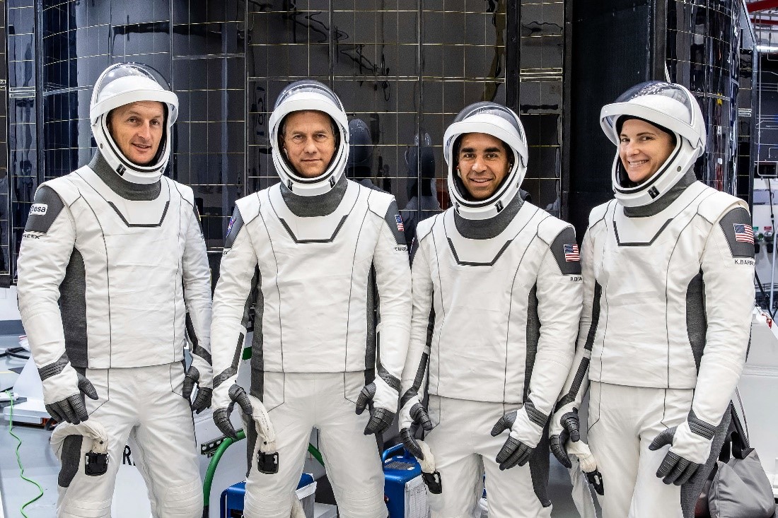 Crew-3 astronauts Matthias Maurer, Thomas Marshburn, Raja Chari, and Kayla Barron pose for a photo in their SpaceX spacesuits.