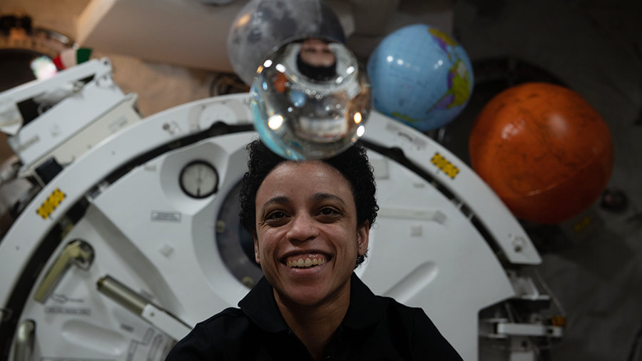 NASA astronaut Jessica Watkins observes the behavior of a free-flying water bubble inside the International Space Station's Kibo laboratory module.