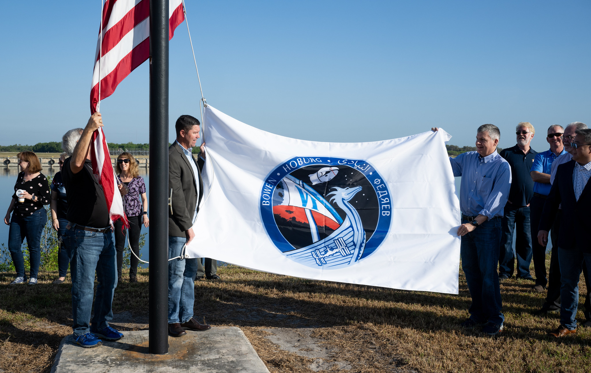 Raising the flag for NASA's SpaceX Crew-6 mission at Kennedy Space Center