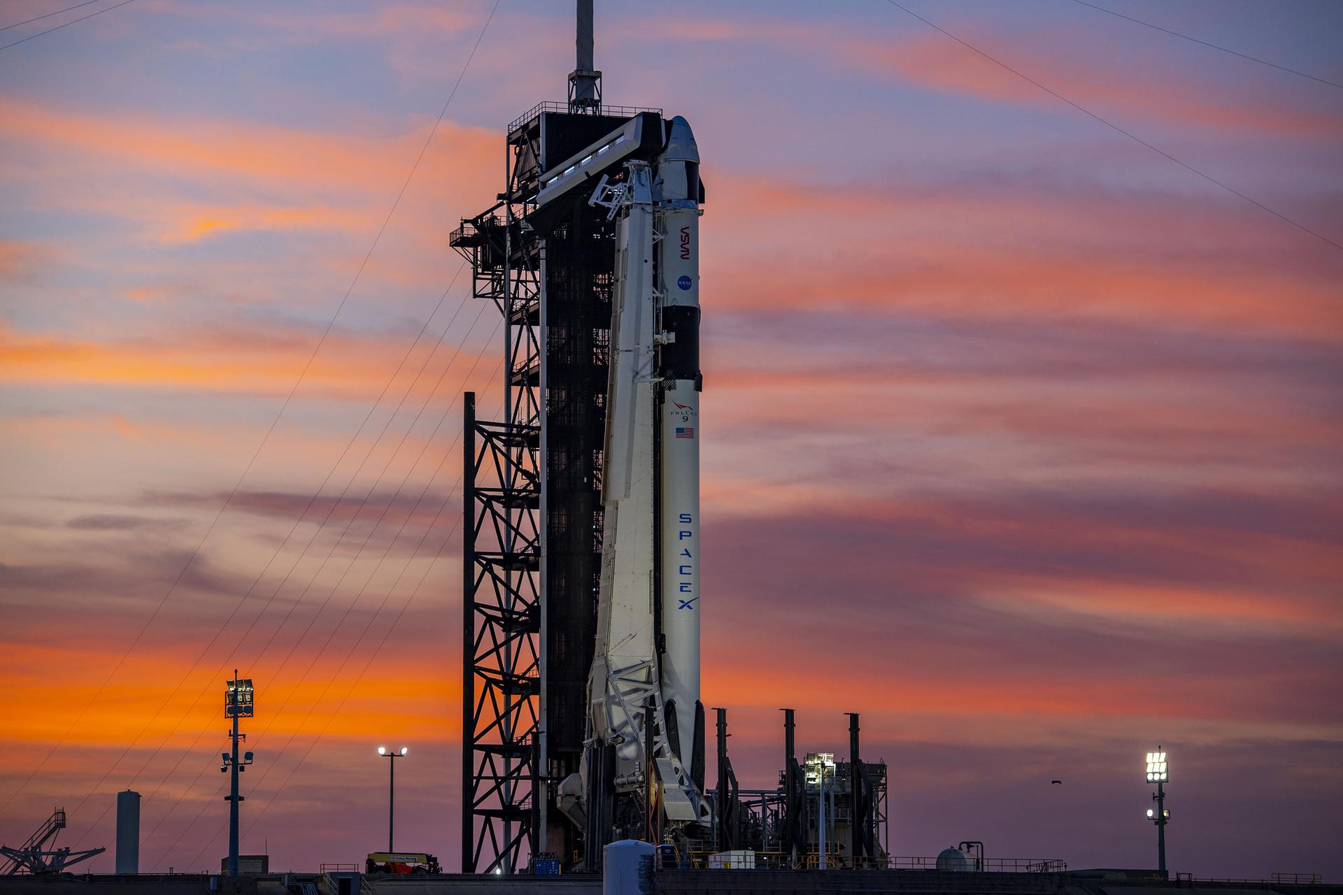 The SpaceX Falcon 9 rocket and Dragon Endeavour spacecraft at sunset at Kennedy Space Center for the Crew-6 mission