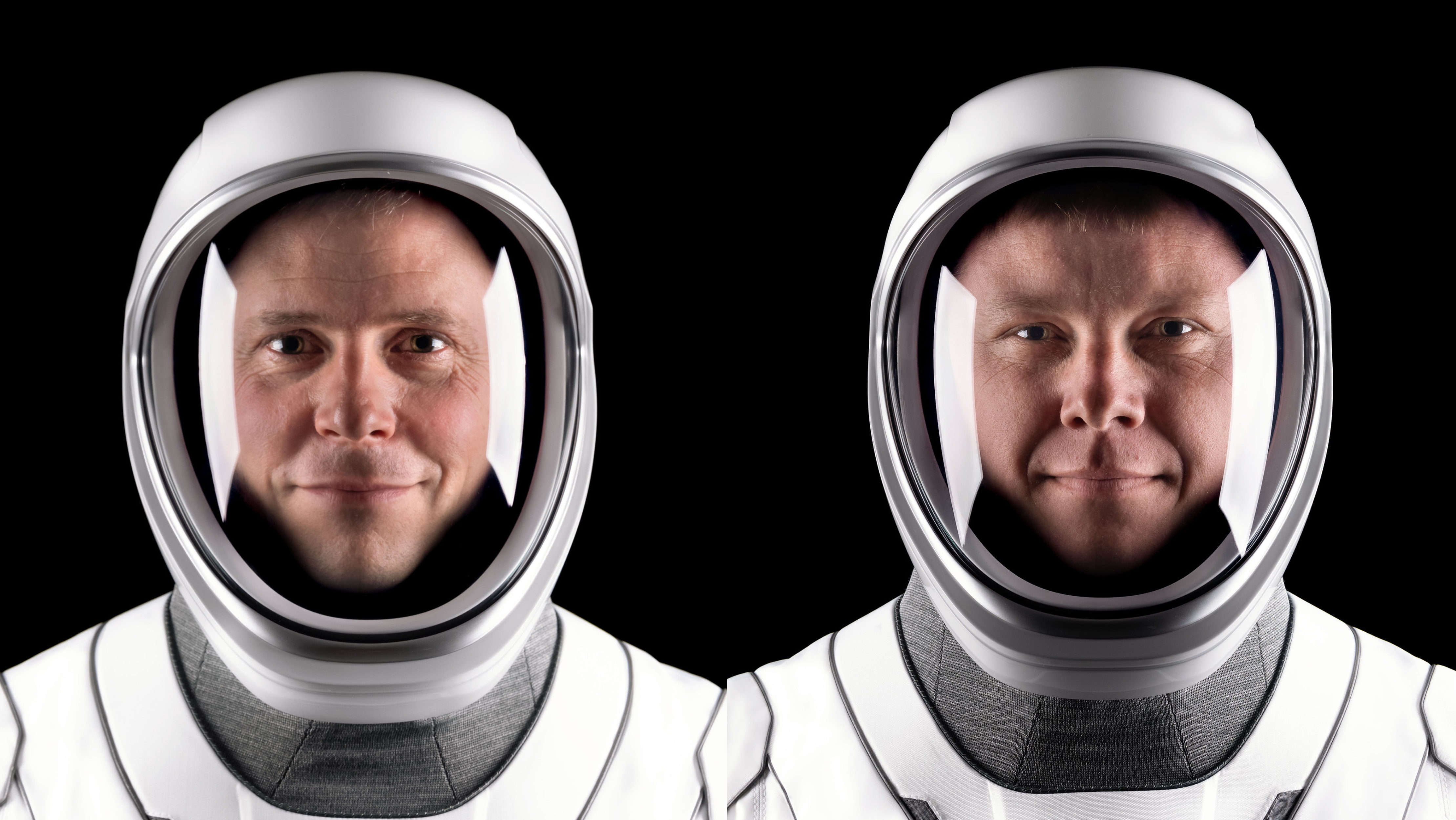 NASA astronaut Nick Hague (left) and Roscosmos cosmonaut Aleksandr Gorbunov pose for portraits in their flight suits.