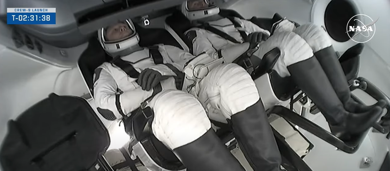 Image shows NASA's SpaceX Crew-9 members secured inside Dragon spacecraft.