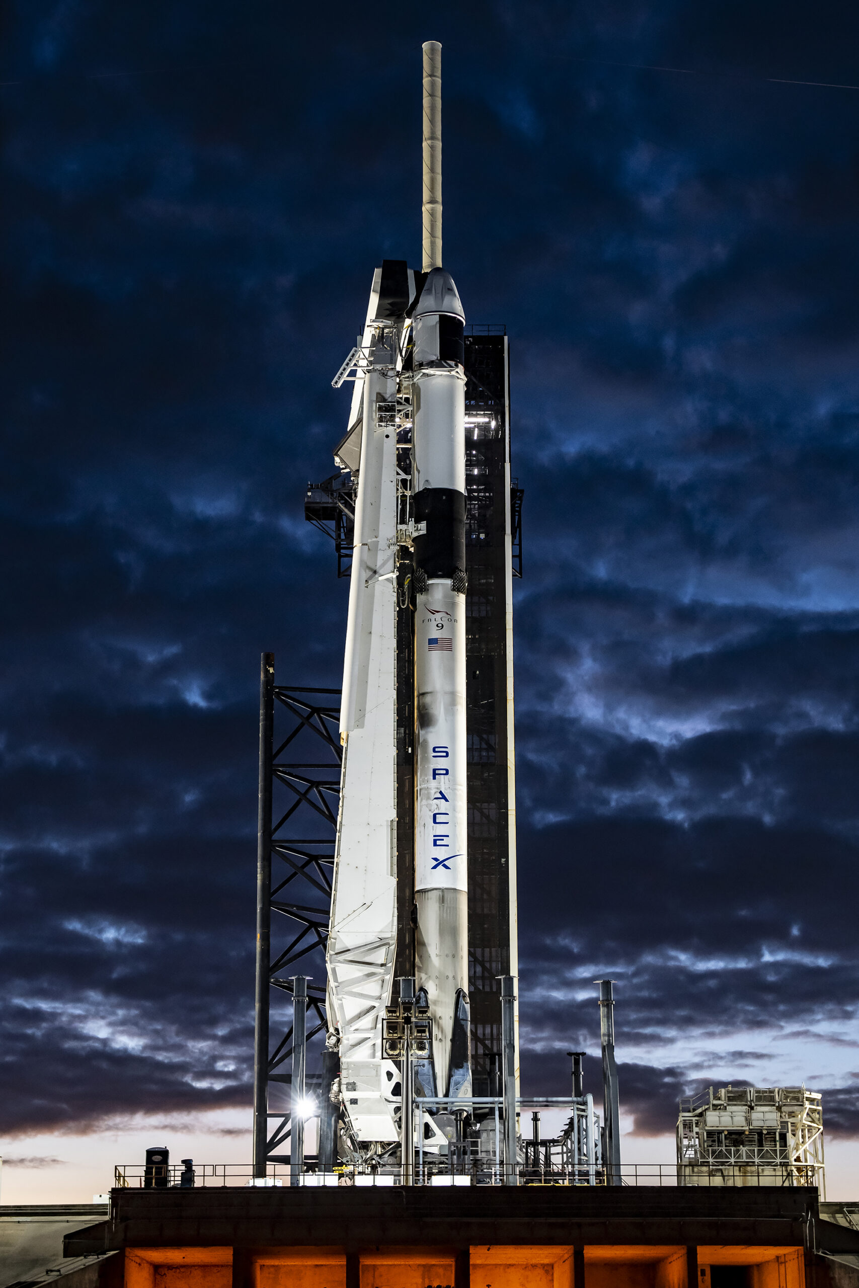 SpaceX Falcon 9 rocket and Dragon capsule at NASA's Kennedy Space Center at sunet.