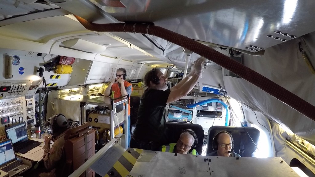 Scientist working on airplane.