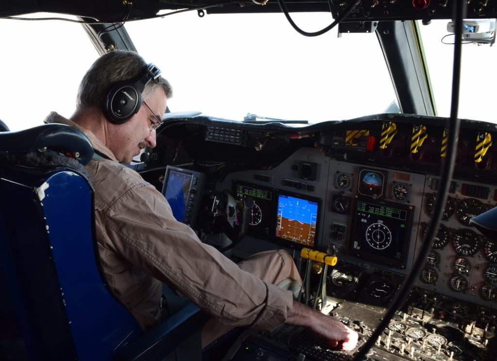 P-3 pilot Mike Singer from NASA’s Wallops Flight Facility guides the aircraft through maneuvers designed to collect maximum measurements of aerosols and clouds. Credit: NASA/Jane Peterson